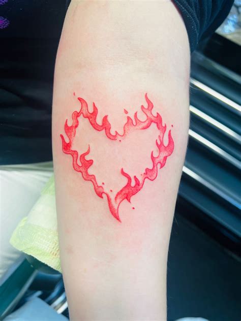 heart and flame tattoos|flaming heart tattoo meaning.